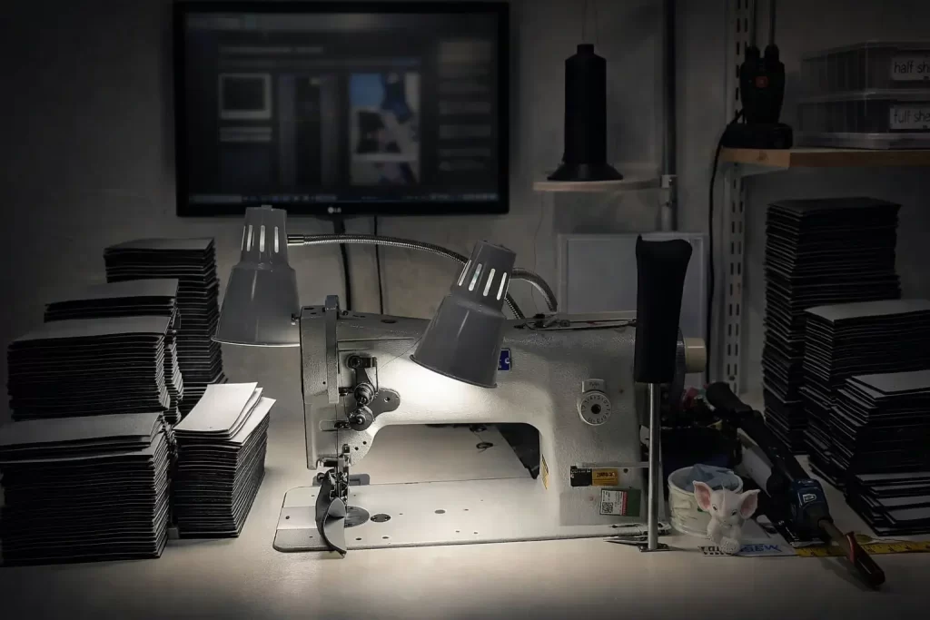 Industrial sewing machine producing custom sewn protective cases in a documented manufacturing process